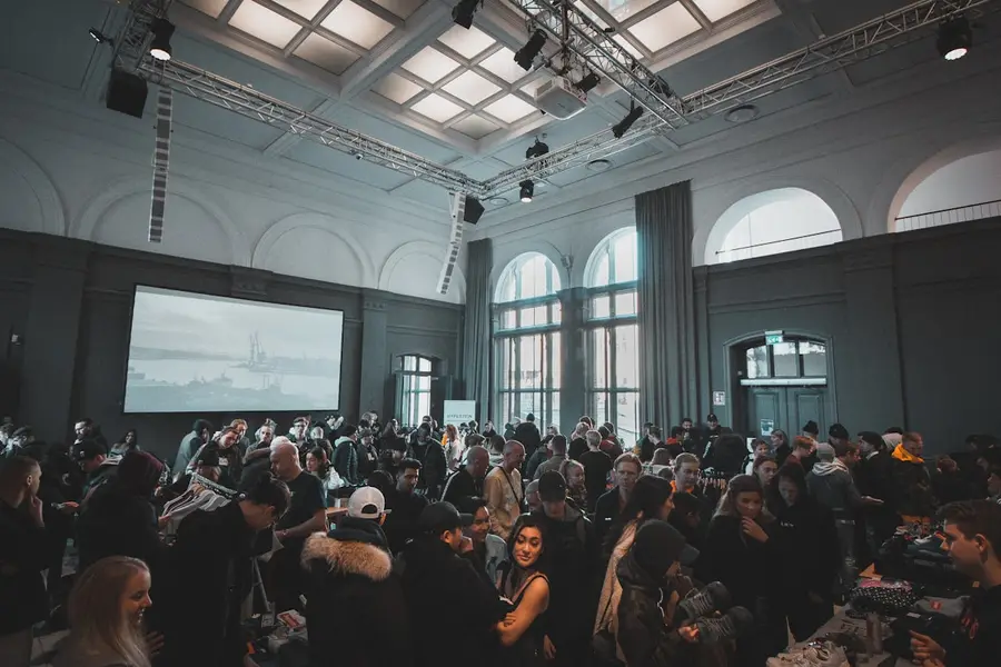 Crowded cultural event in a grand hall