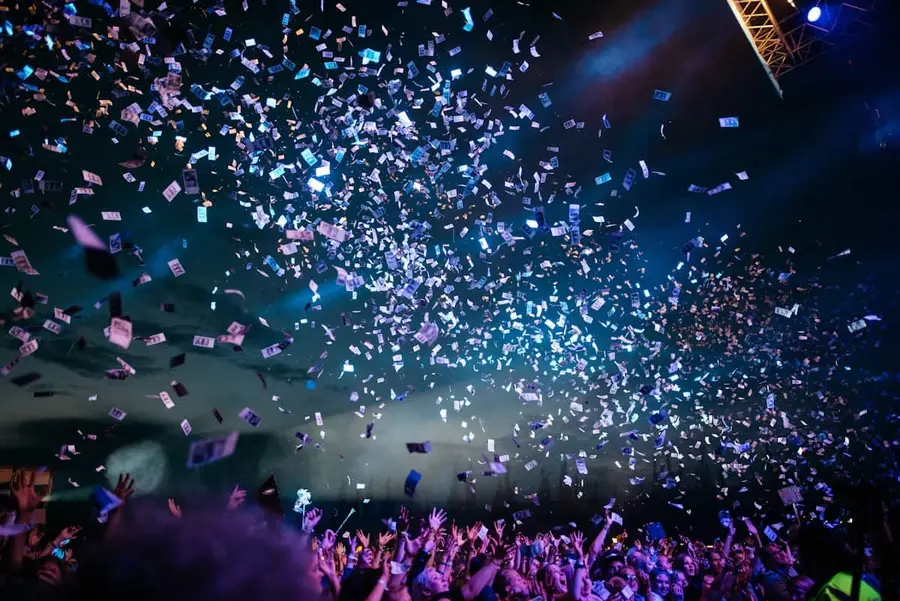 Confetti falling over a celebrating crowd